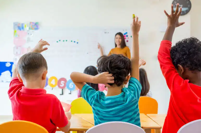Happy children learning in a classroom