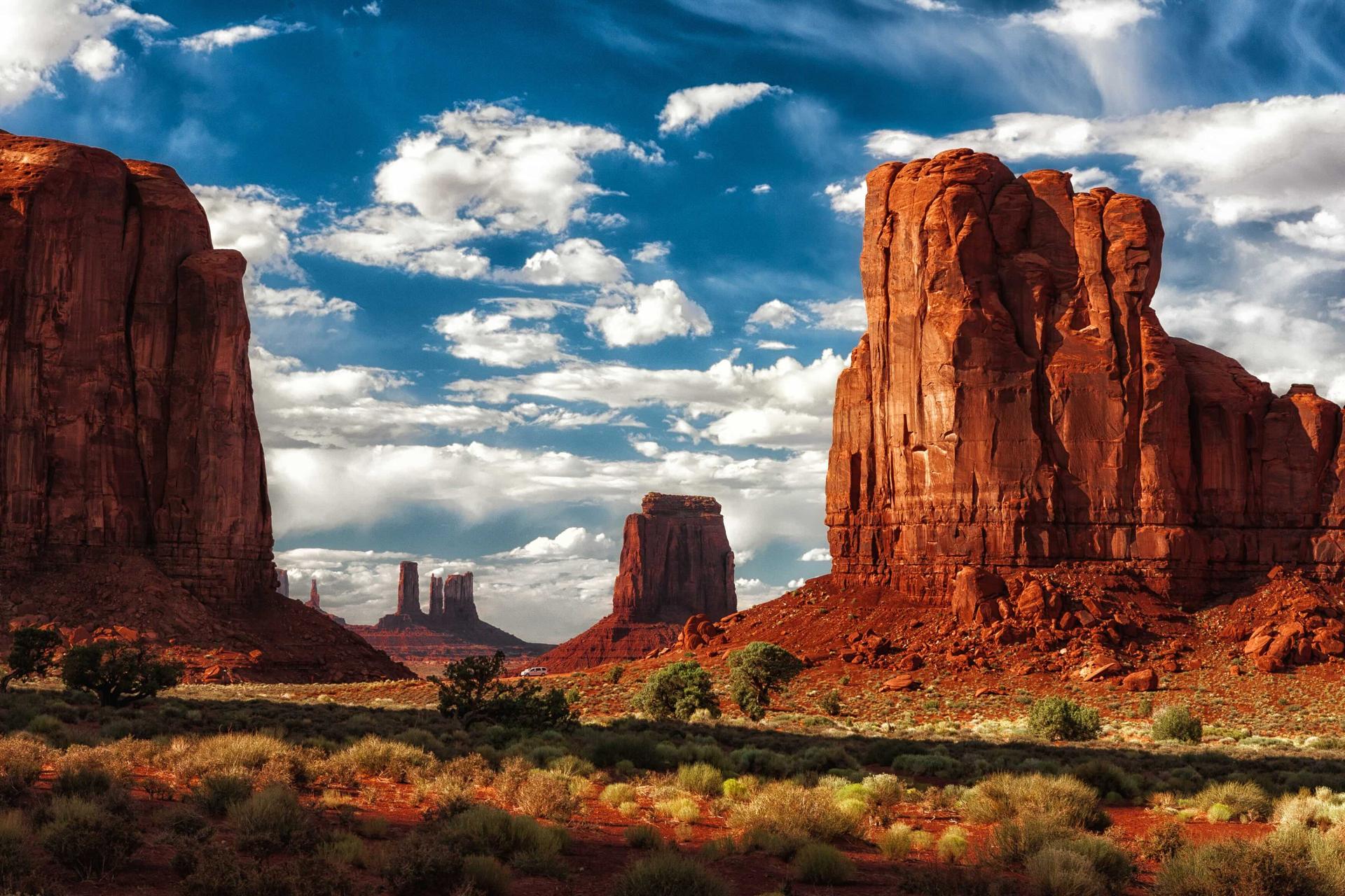 Wild West frontier landscape with desert vistas and cowboy elements, evoking the spirit of the American frontier era