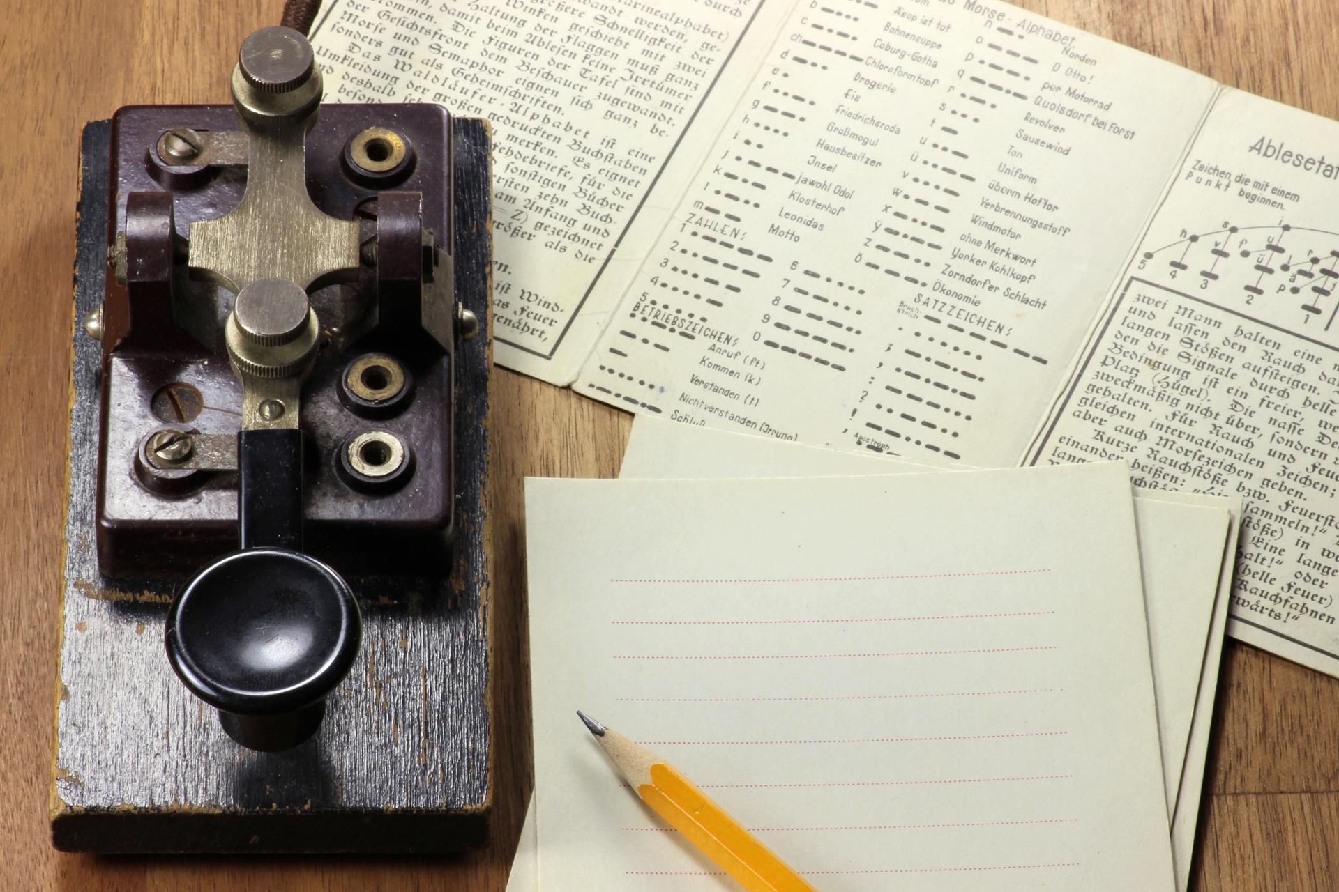 Vintage morse code telegraph machine evoking the signalling systems used during World War 2 for coded military communications