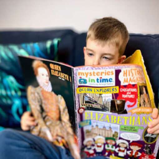 Boy Reading History Magazine