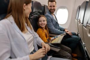 family on the plane with travel activity pack